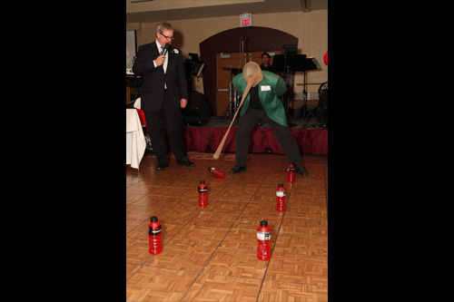 Playing a game - knocking over gatorade bottles