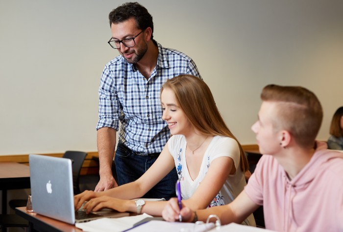 Teacher with two students