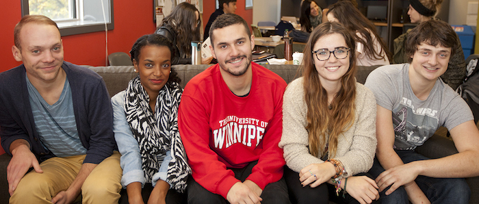 UWinnipeg students inside sitting on couch