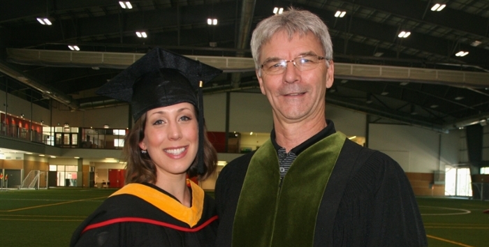 Graduating student Renée Plante in cap and gown with Professor Glen Bergeron
