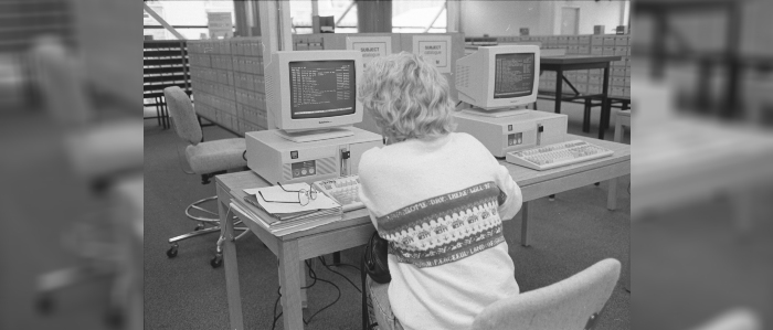 Black and white photo of student using computer