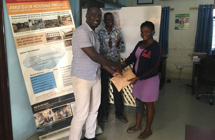 Elijah Osei-Yeboah (L) with PD staff at his farewell ceremony