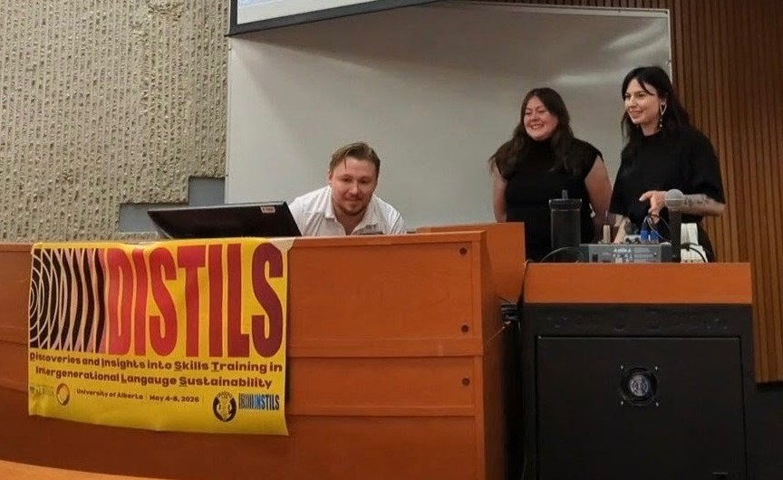 Jackie and other presenter at Language conference