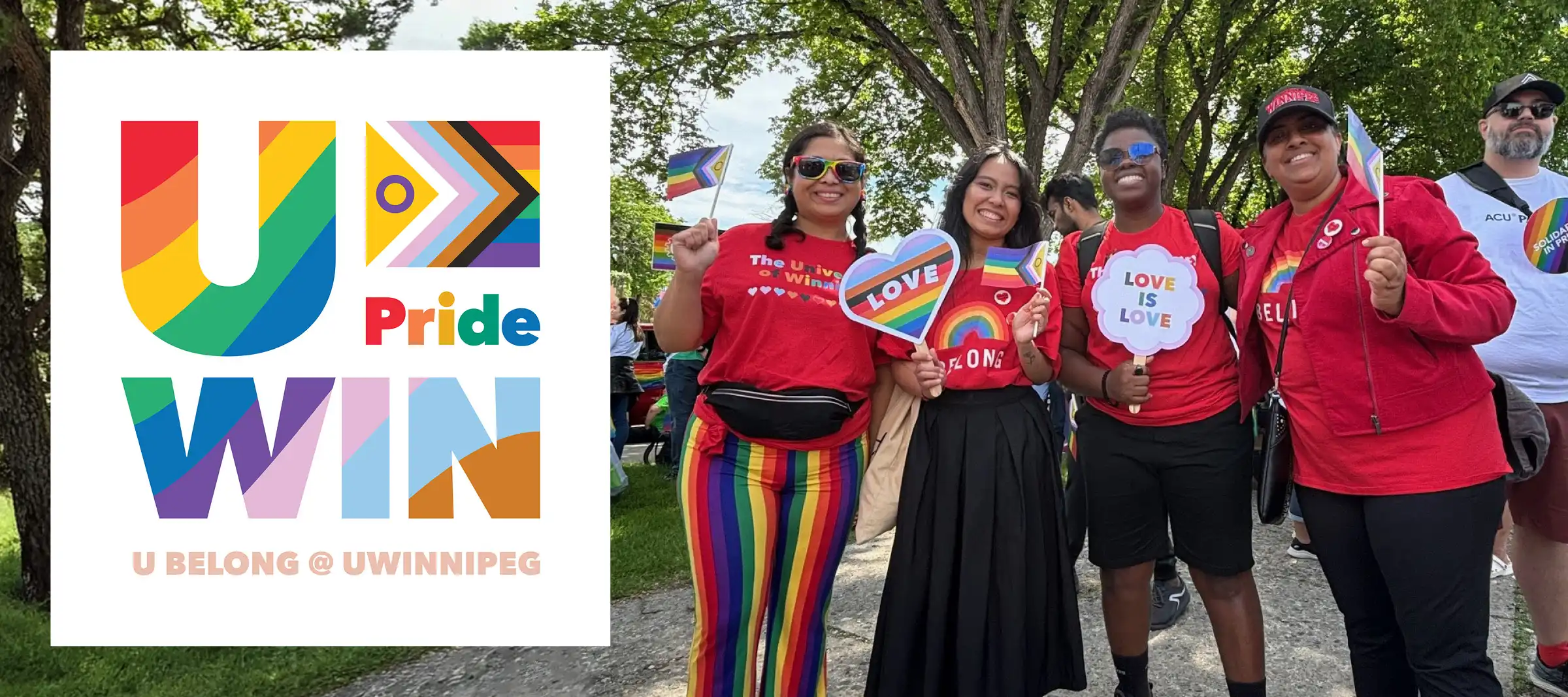 Four people in red t-shirts smile at camera holding Pride signage. Banner reads UWIN Pride.