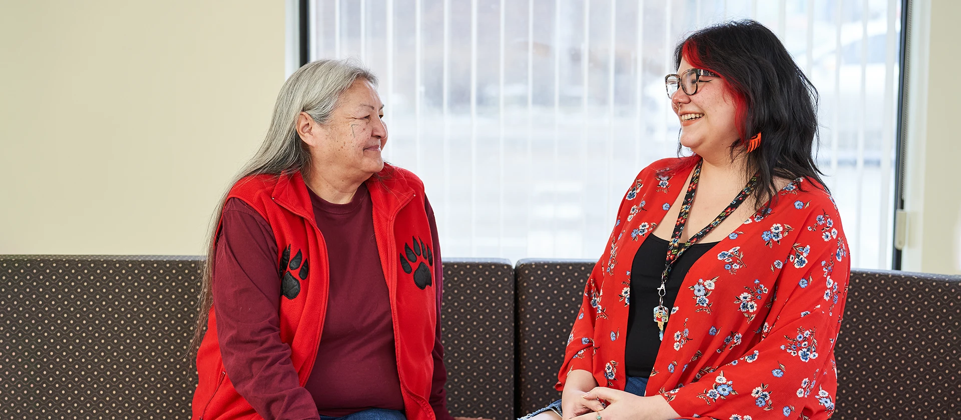 Two people in conversation at UWinnipeg