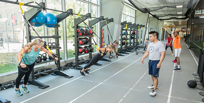 People taking part in a fitness class on the RecPlex track.