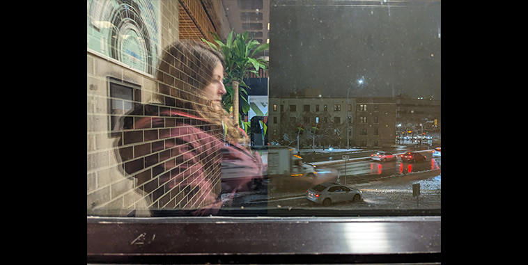 Split image, on the left the reflection of a woman sitting, on the right cars driving at night in the snow
