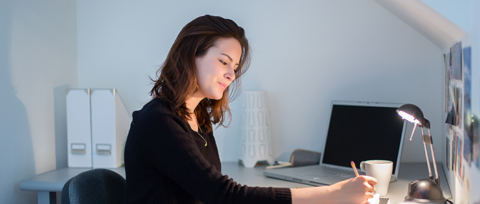 Student at her desk at home.