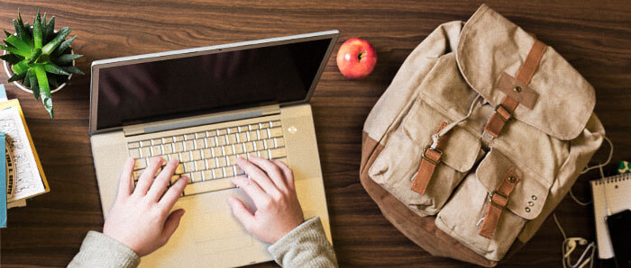 Hands on a laptop