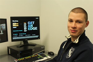 Student working with the Bloomberg Terminal Database