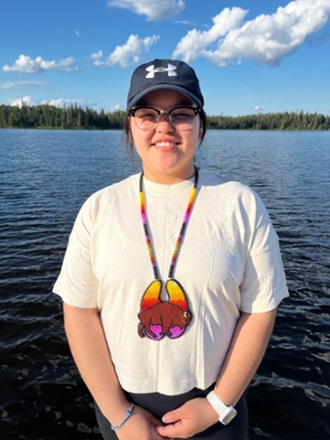 Neepin Cook standing in front of lake