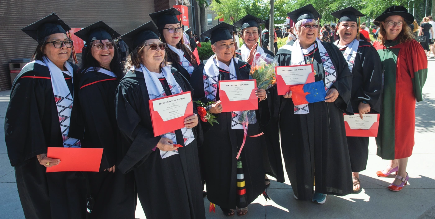 Developmental Studies Program graduates pose with degrees at Spring Convocation