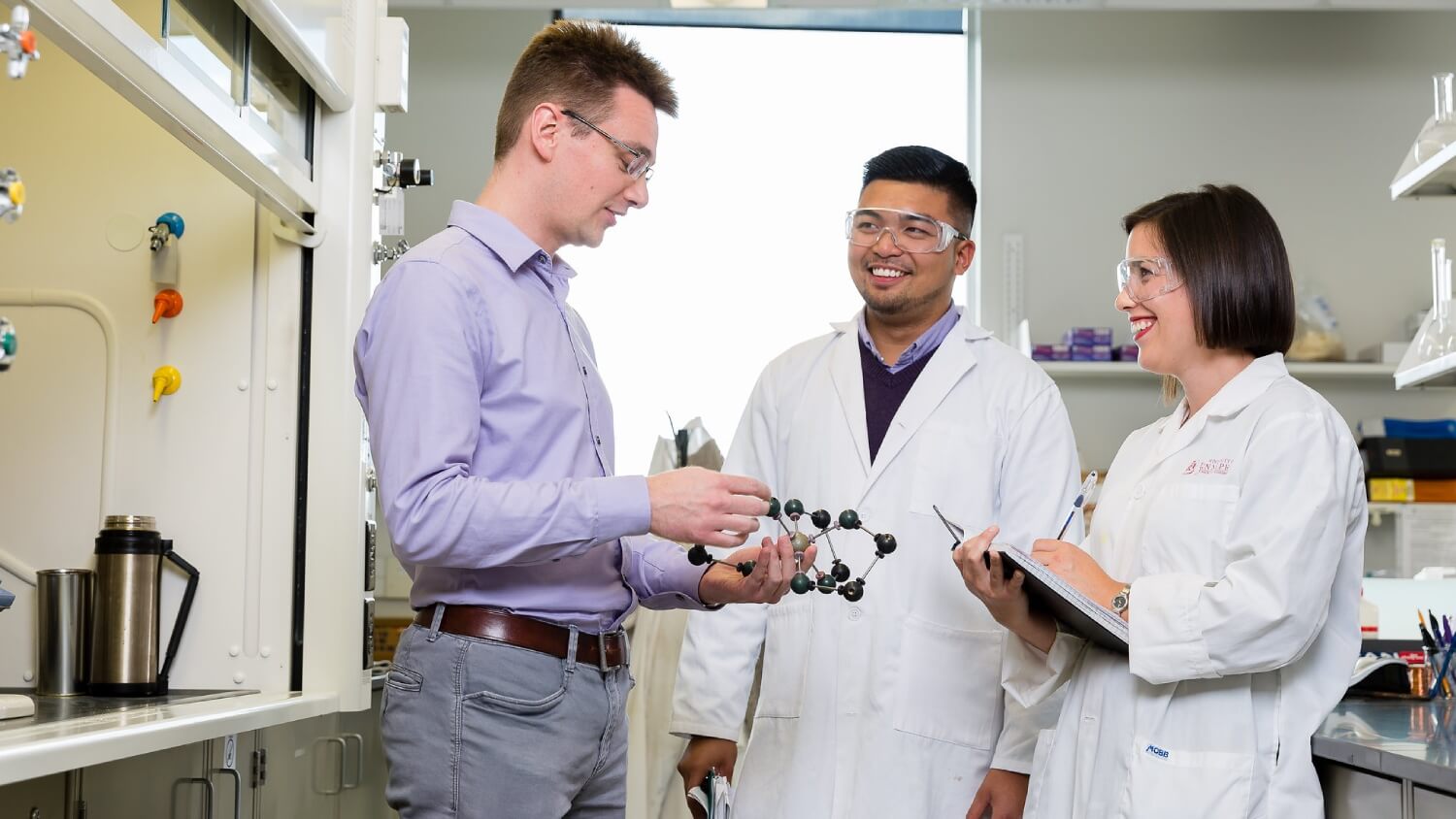 Student operating equipment in laboratory