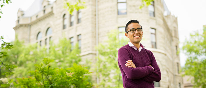 Student in front of Wesley Hall