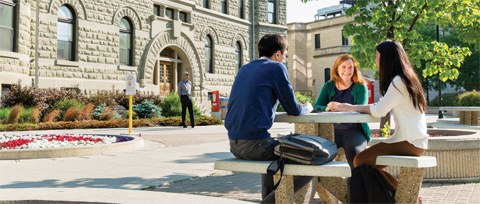 People sitting at picnic table