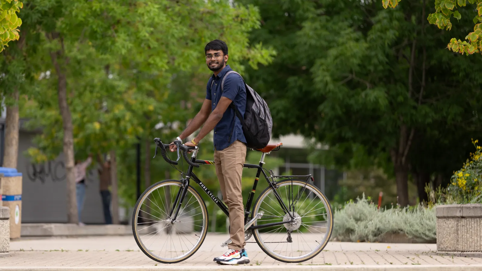 Student on a Bike looking at the camera