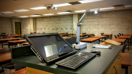 Desk with computer and projector equipment