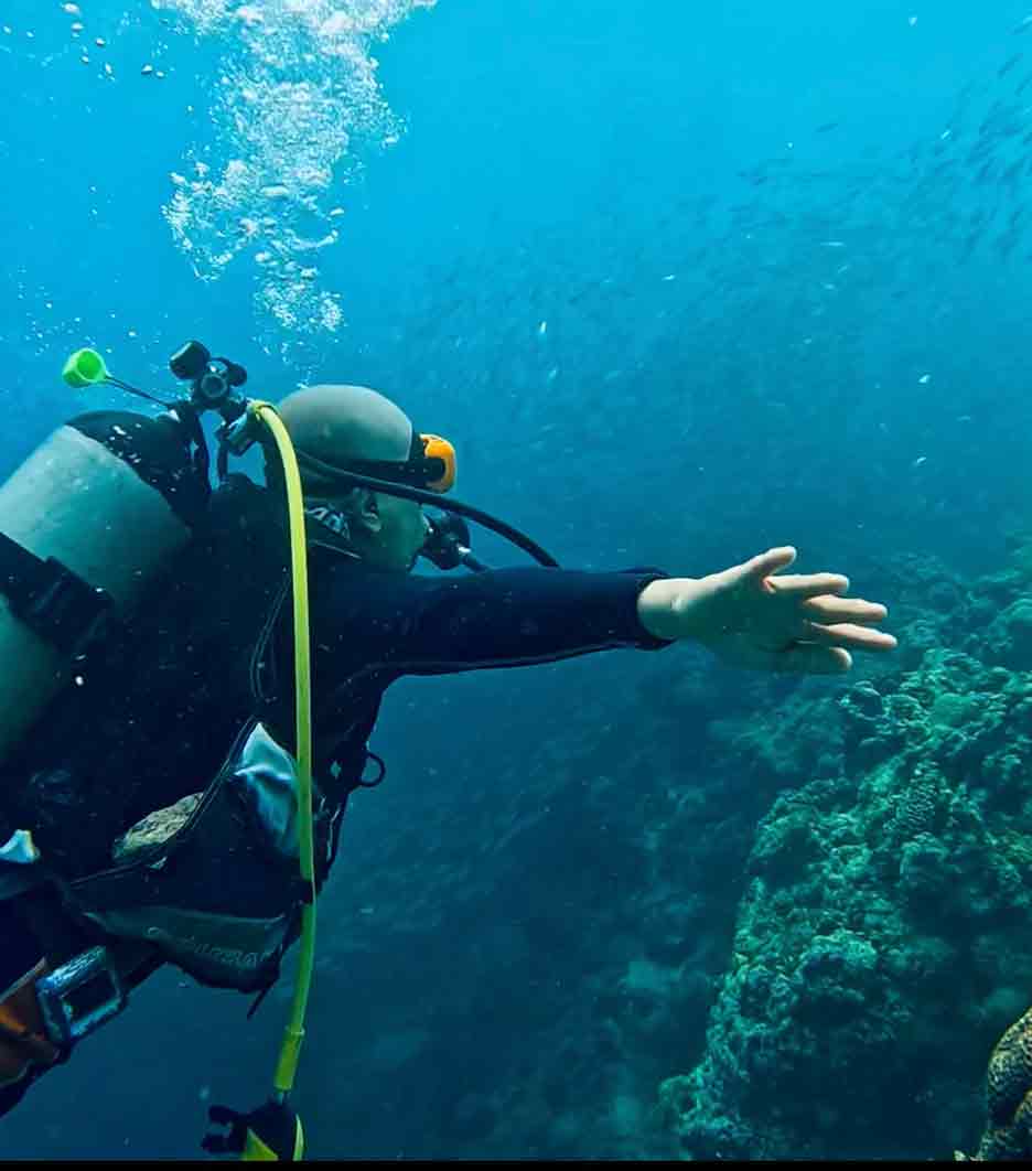 Dennis conducting exploratory under water site visit to see corals and rock formations devastated by Super Typhoon Odette
