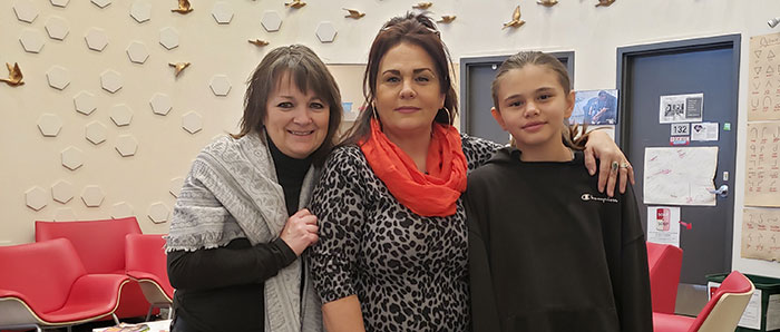 UIC student and her daughter with the Department Chair, Dr. MacKinnnon