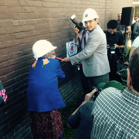 Elder Stella Blackbird and UWSA Vice President Kevin Settee taking a swing at the old Merch