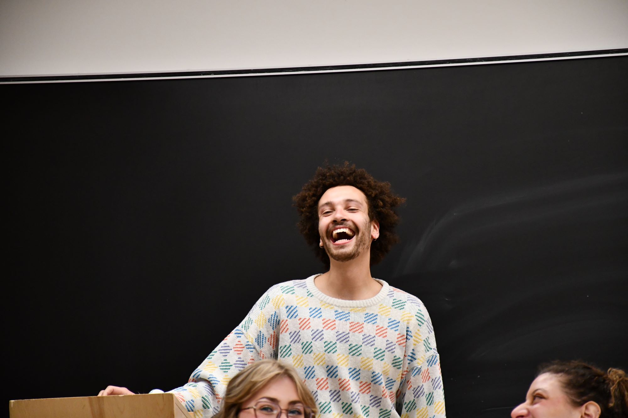 Kim laughs during his WGS Practicum panel presentation